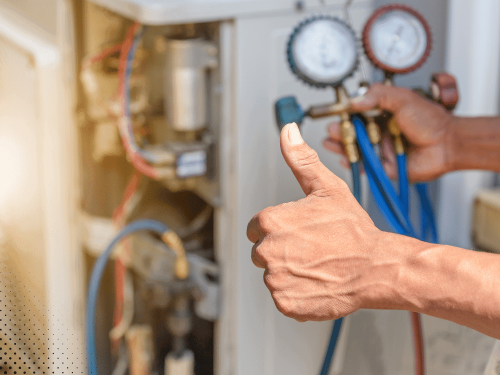 Sure Thing Home Inspections - Technician checking HVAC pressure gauges with thumbs up
